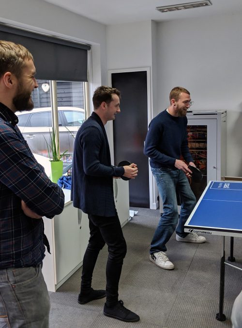 coast digital team playing ping pong