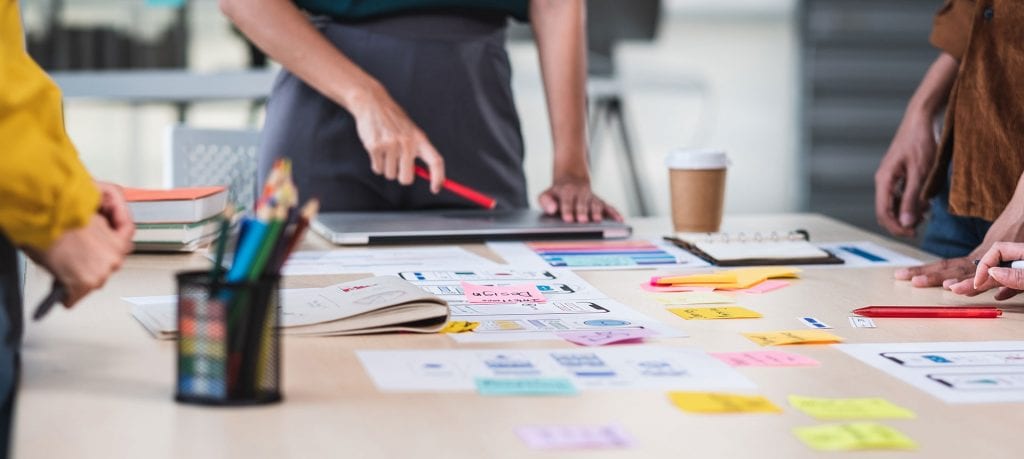 Website designer looking at design ideas for a site build