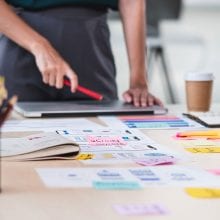 Website designer looking at design ideas for a site build